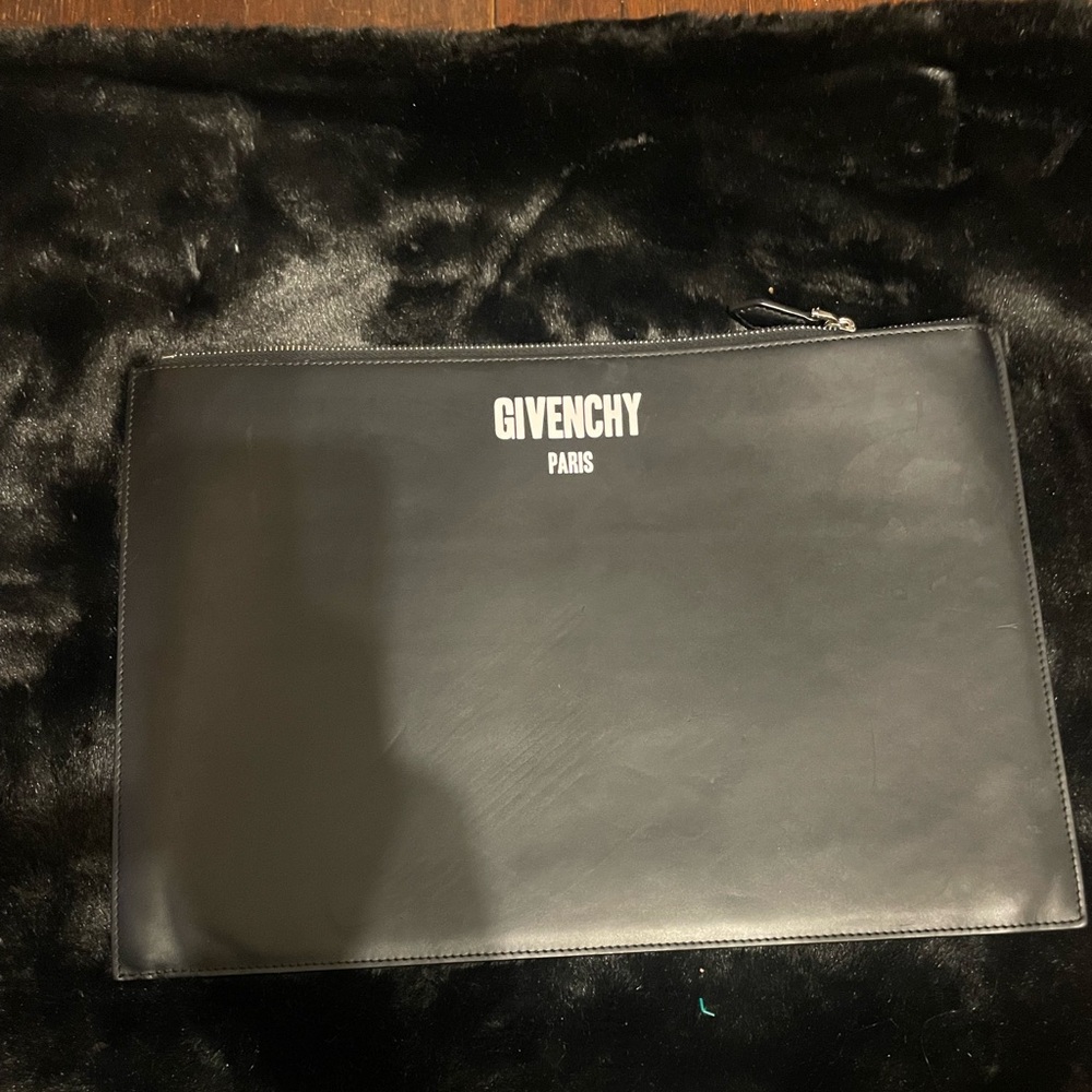 Givenchy Ultra thin black leather clutch with zip closure.Excellent condition.